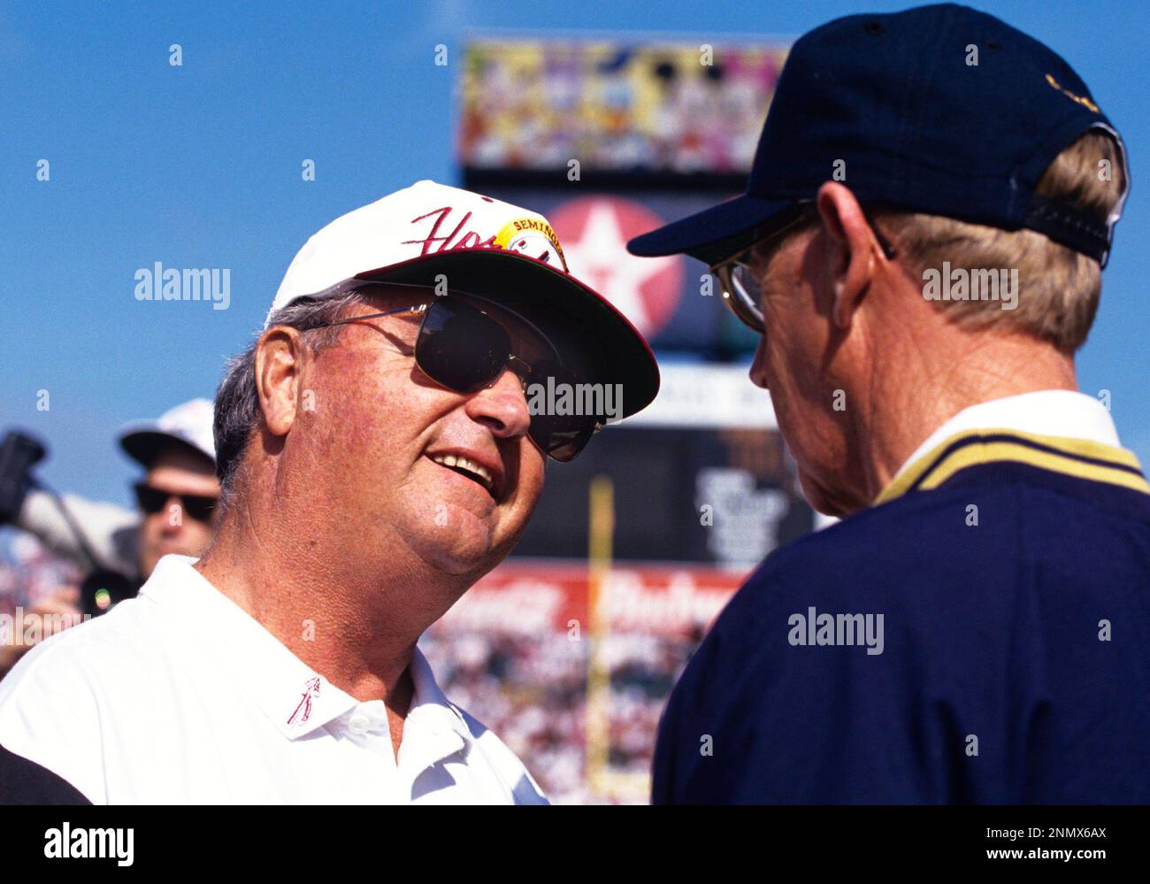 Coach Bobby Bowden of Florida State University talks with coach Lou ...