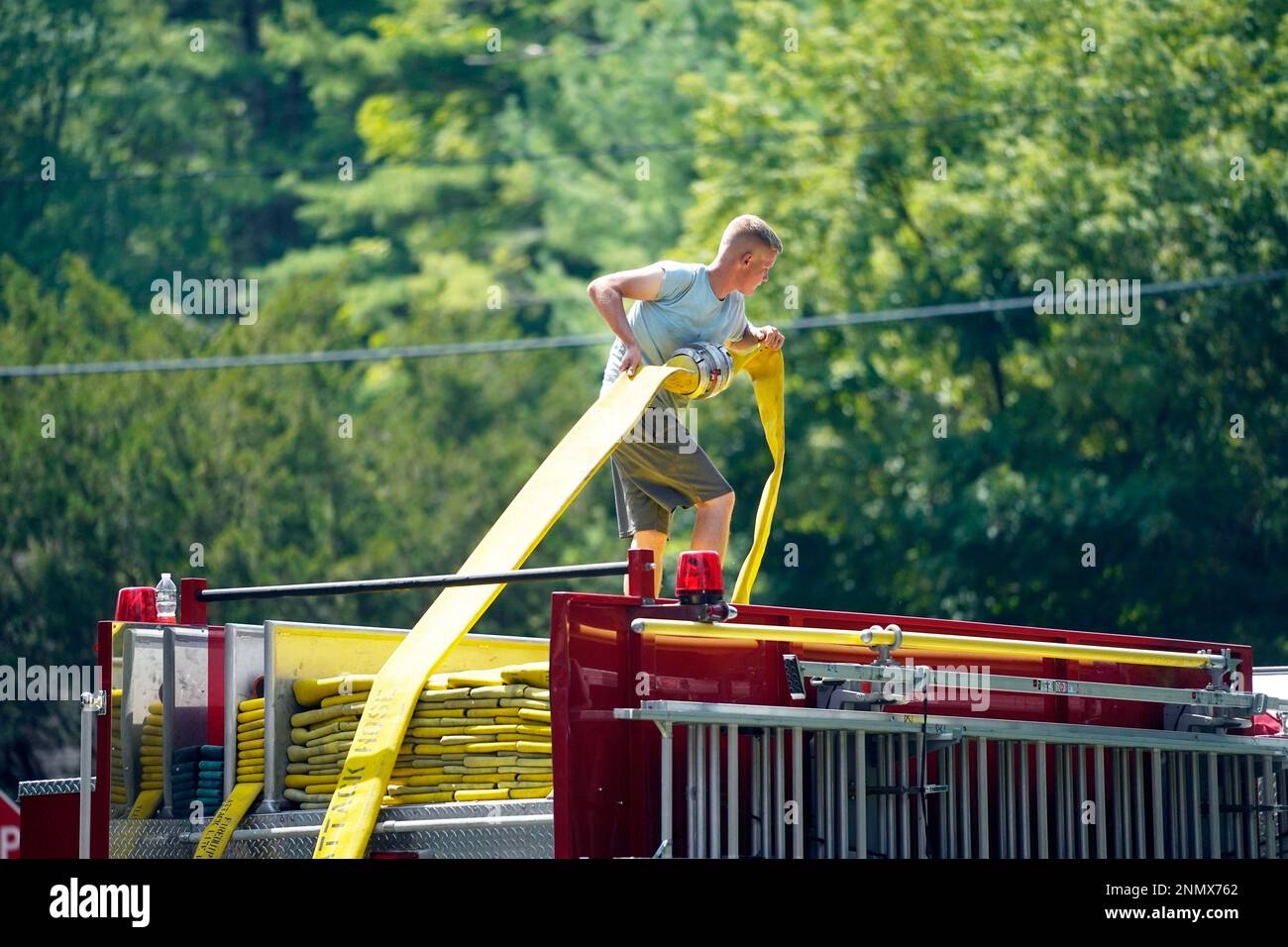Sawyer Wilson replaces the fire hose on Engine 2 in Stockbridge, Mass
