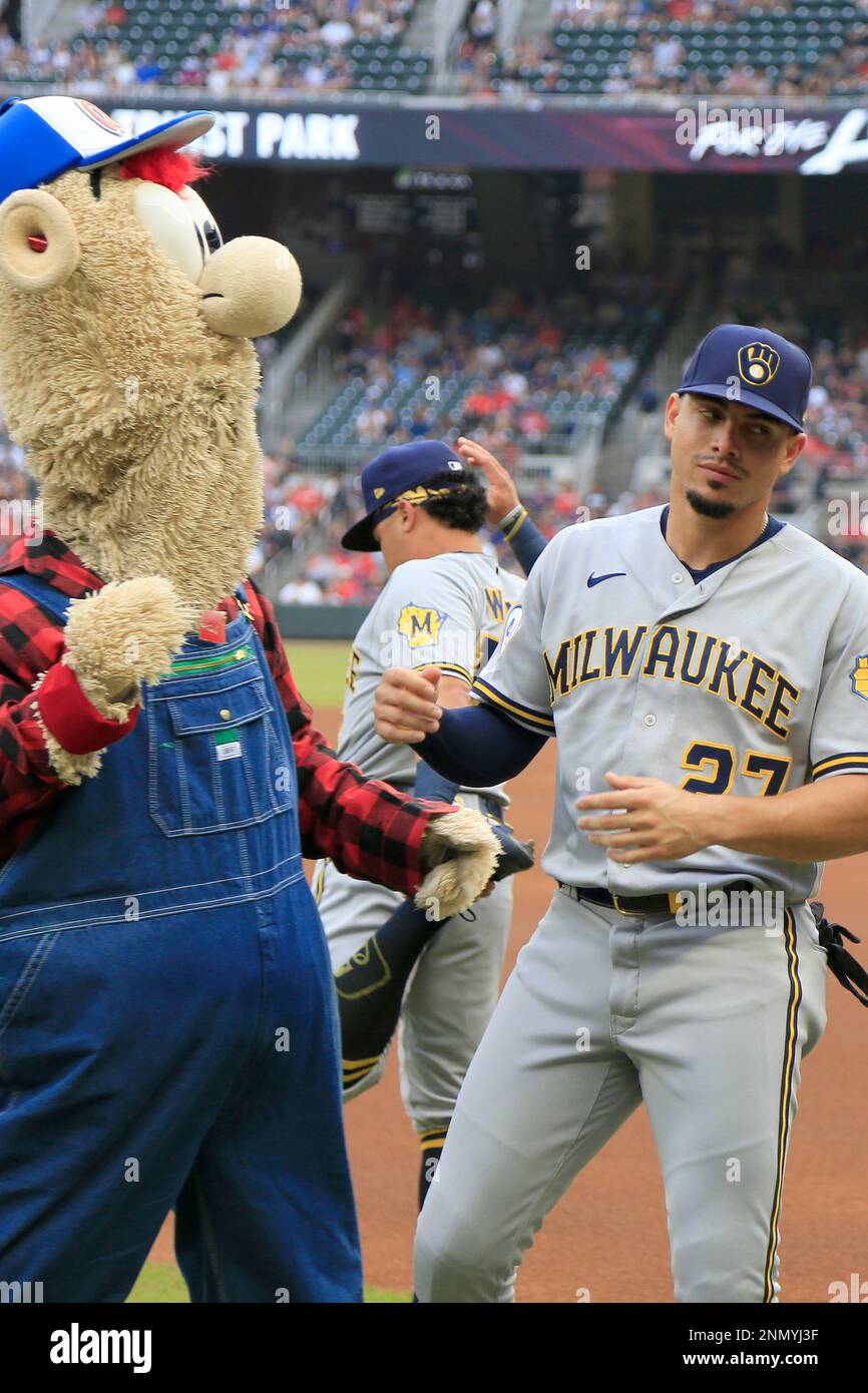 ATLANTA, GA - JULY 31: Braves mascot Blooper fools around with some of the  Brewers players before the Saturday evening MLB game between the Atlanta  Braves and the Milwaukee Brewers on July