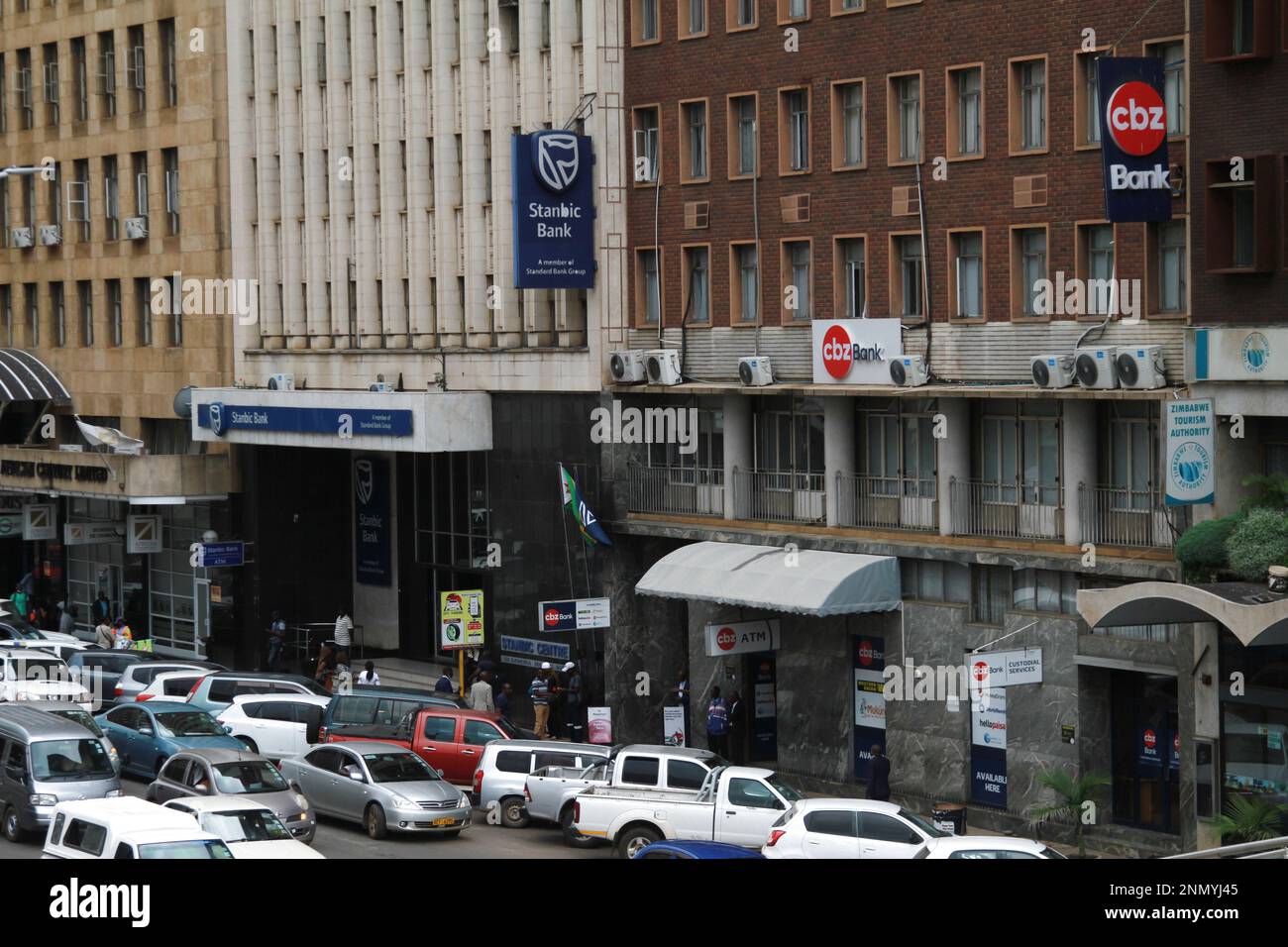 Harare, Zimbabwe. 23rd Feb, 2023. Traffic is seen in front of banking halls in Harare, Zimbabwe, Feb. 23, 2023. Despite not being officially dollarized, the Zimbabwean economy has largely accepted the U.S. dollar as the medium of trade, as indicated by the growing trend towards U.S. dollar usage in domestic transactions. Credit: Tafara Mugwara/Xinhua/Alamy Live News Stock Photo