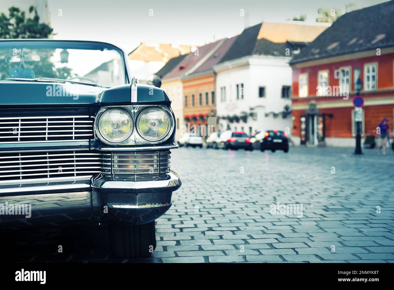 Vintage car on old city street Stock Photo - Alamy