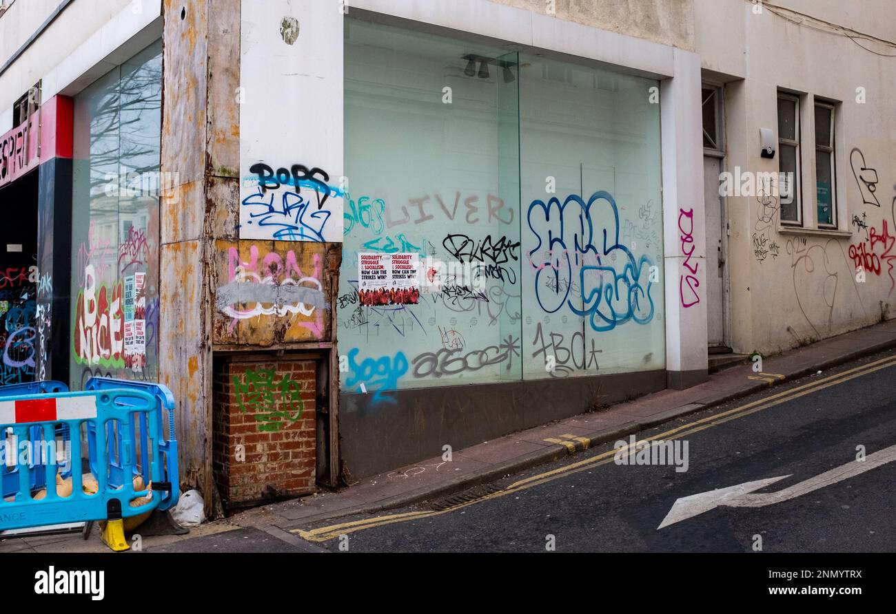Brighton UK 25th February 2023 - Graffiti tagging in and around Western Road in Brighton which is one of the major shopping districts of the city . Graffiti tagging has become a major problem recently for towns and cities across the country : Credit Simon Dack / Alamy Live News Stock Photo