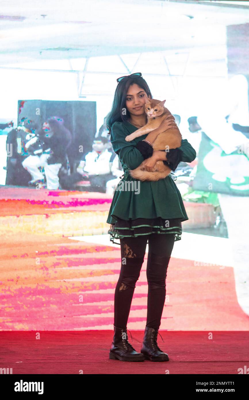 Dhaka, Bangladesh. 24th Feb, 2023. A cat owner shows off her pet cat