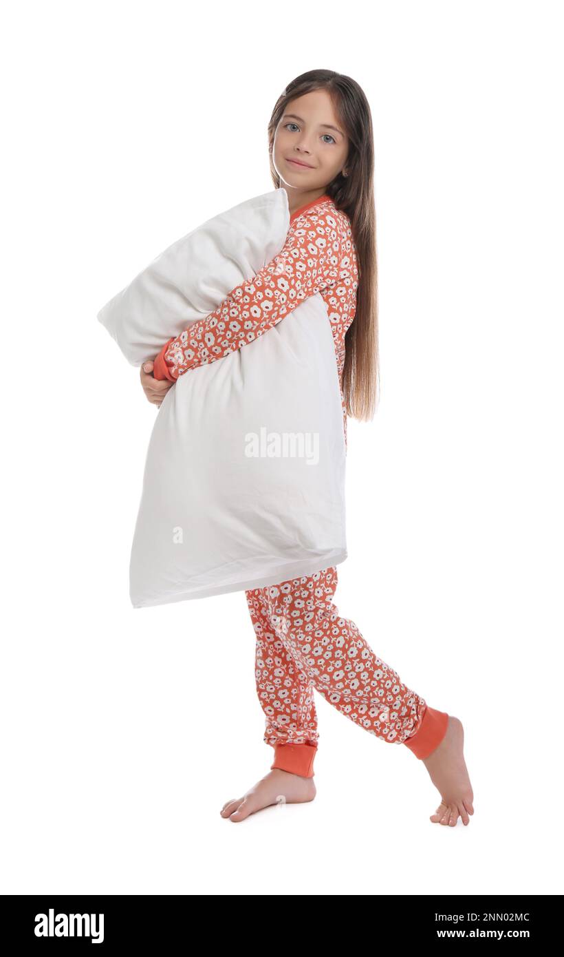 Cute girl wearing pajamas with pillow on white background Stock Photo ...