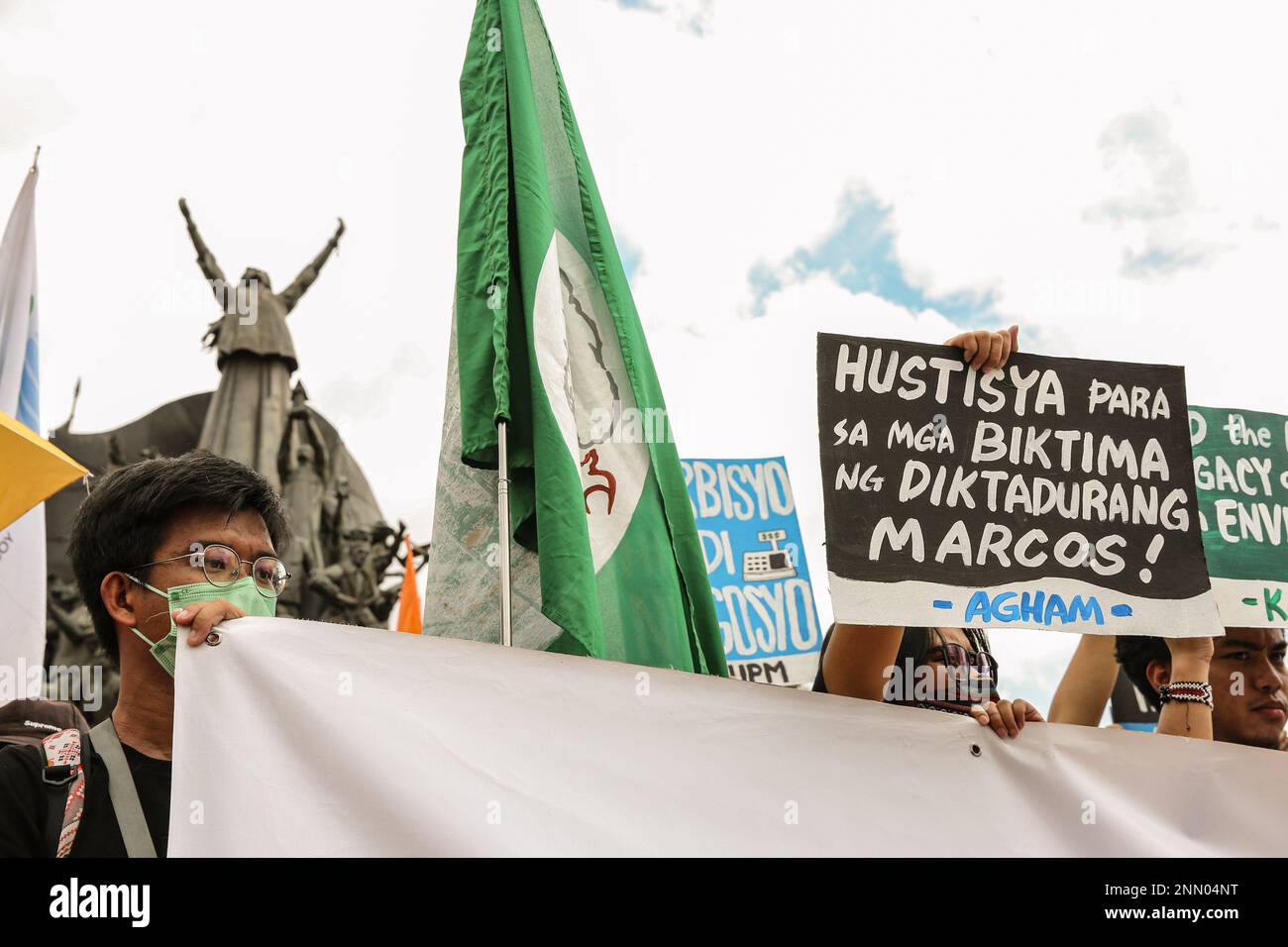 Quezon, Philippines. 25th Feb, 2023. Protesters hold placards expressing their opinion during a demonstration. Demonstrators hold a protest in the EDSA People Power monument in celebration of the 37th anniversary of the People Power Revolution. It is also the first People Power Anniversary under Marcos Jr.'s administration. Credit: SOPA Images Limited/Alamy Live News Stock Photo