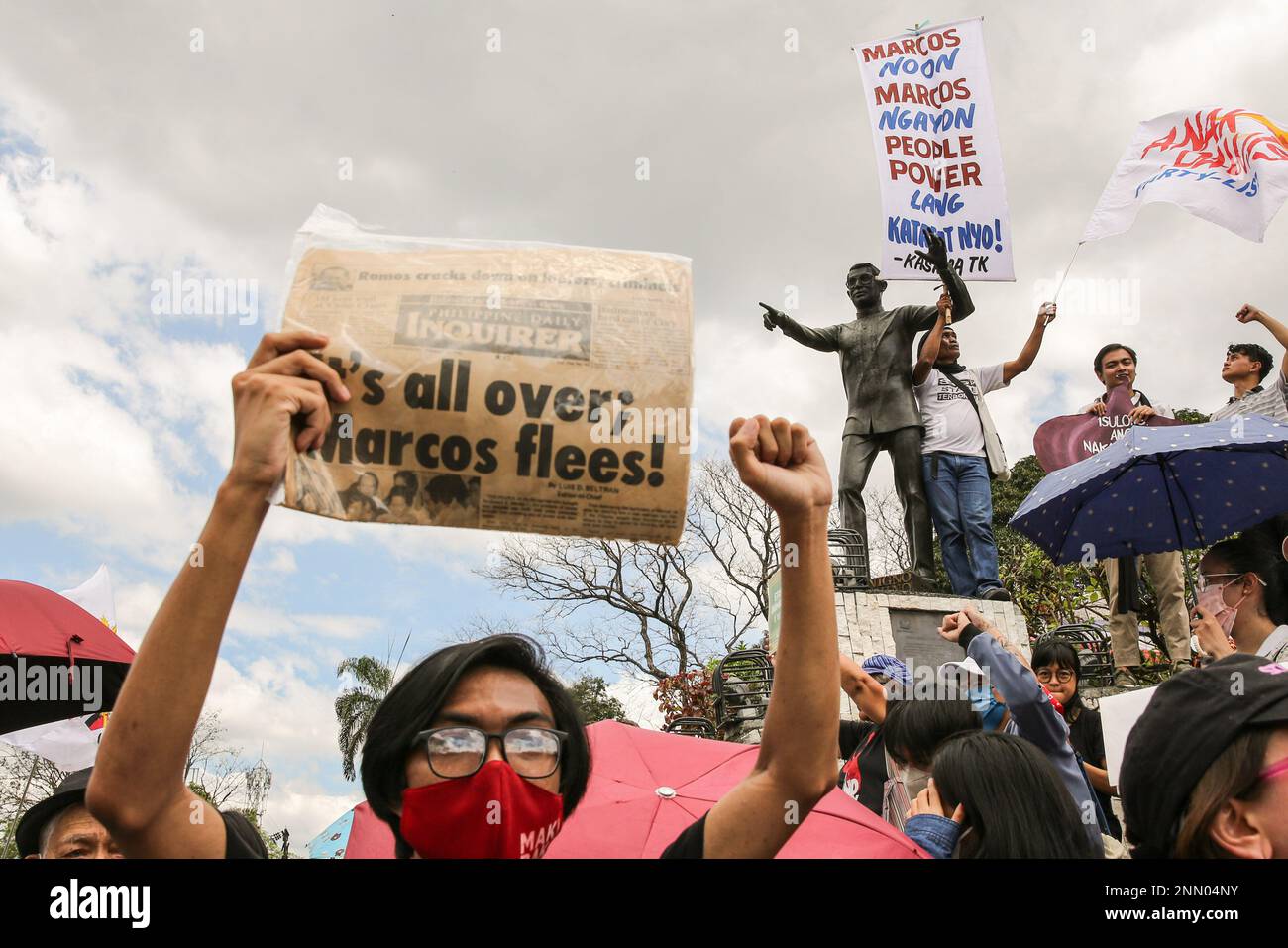 Quezon, Philippines. 25th Feb, 2023. Protesters hold placards expressing their opinion during a demonstration. Demonstrators hold a protest in the EDSA People Power monument in celebration of the 37th anniversary of the People Power Revolution. It is also the first People Power Anniversary under Marcos Jr.'s administration. Credit: SOPA Images Limited/Alamy Live News Stock Photo