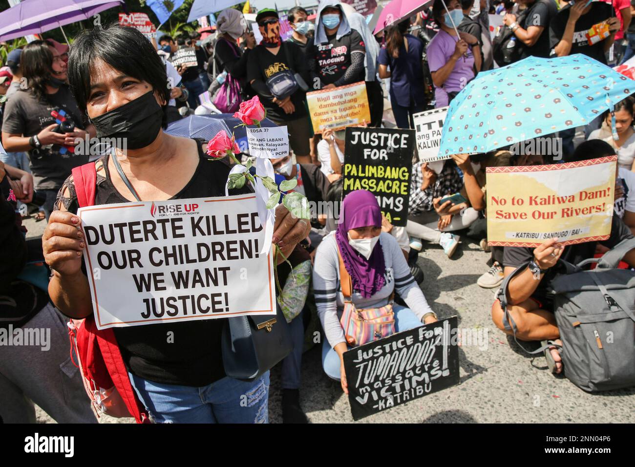 Quezon, Philippines. 25th Feb, 2023. Protesters hold placards expressing their opinion during a demonstration. Demonstrators hold a protest in the EDSA People Power monument in celebration of the 37th anniversary of the People Power Revolution. It is also the first People Power Anniversary under Marcos Jr.'s administration. Credit: SOPA Images Limited/Alamy Live News Stock Photo