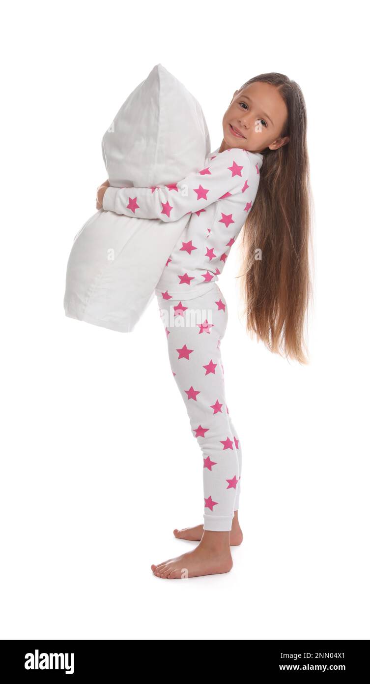 Cute girl wearing pajamas with pillow on white background Stock Photo ...