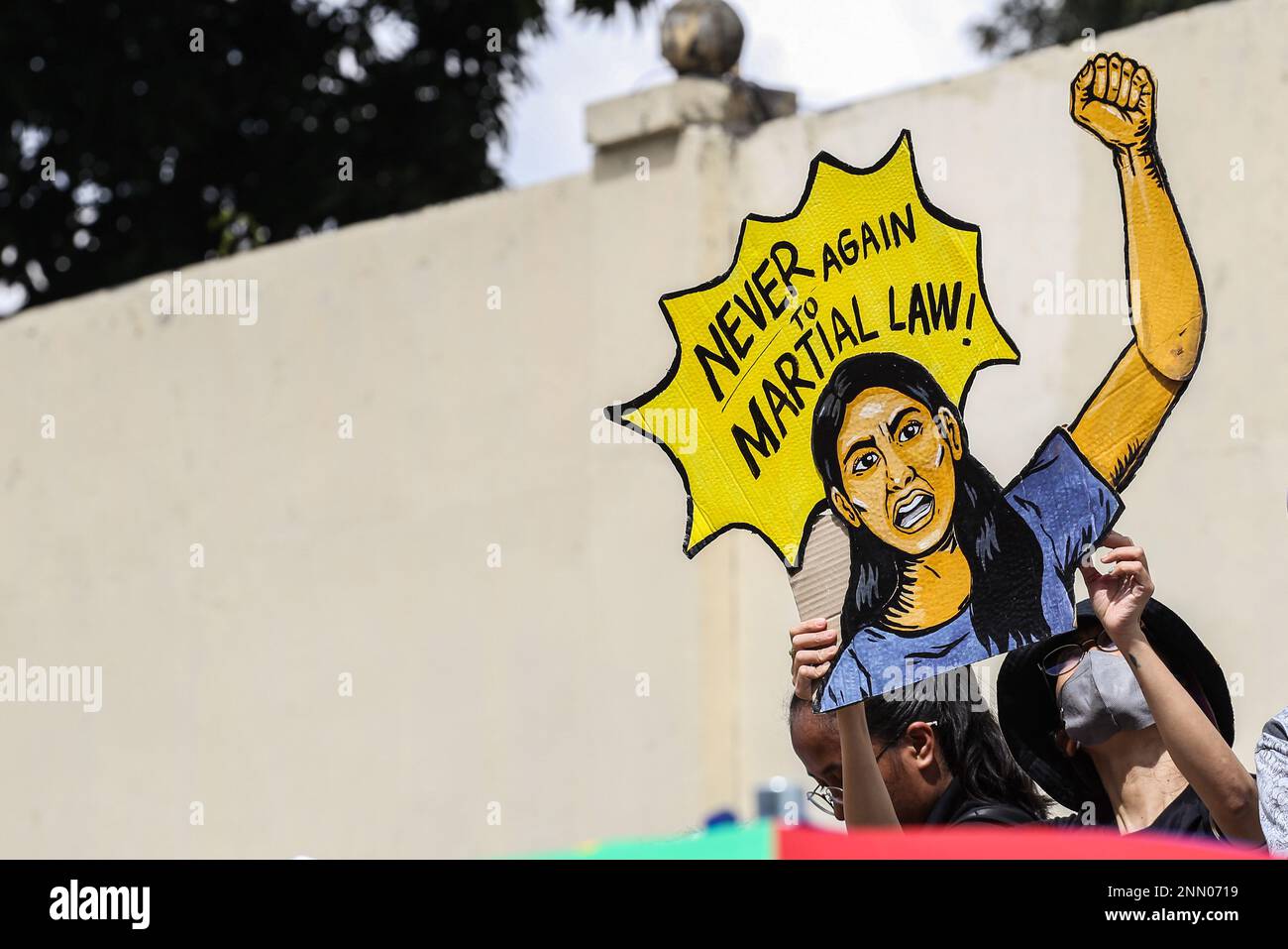 Quezon, Philippines. 25th Feb, 2023. A protester holds a a protest poster during a demonstration. Demonstrators hold a protest in the EDSA People Power monument in celebration of the 37th anniversary of the People Power Revolution. It is also the first People Power Anniversary under Marcos Jr.'s administration. (Photo by Earvin Perias/SOPA Images/Sipa USA) Credit: Sipa USA/Alamy Live News Stock Photo