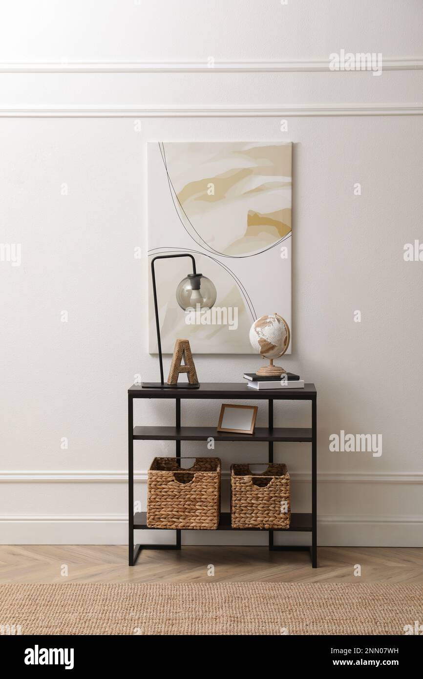 Light hallway interior with stylish console table Stock Photo - Alamy
