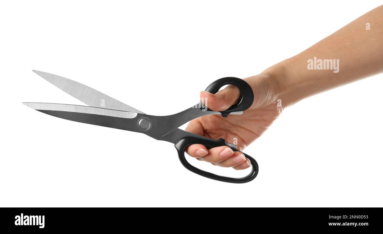 Woman holding tailor's scissors isolated on white, closeup Stock Photo