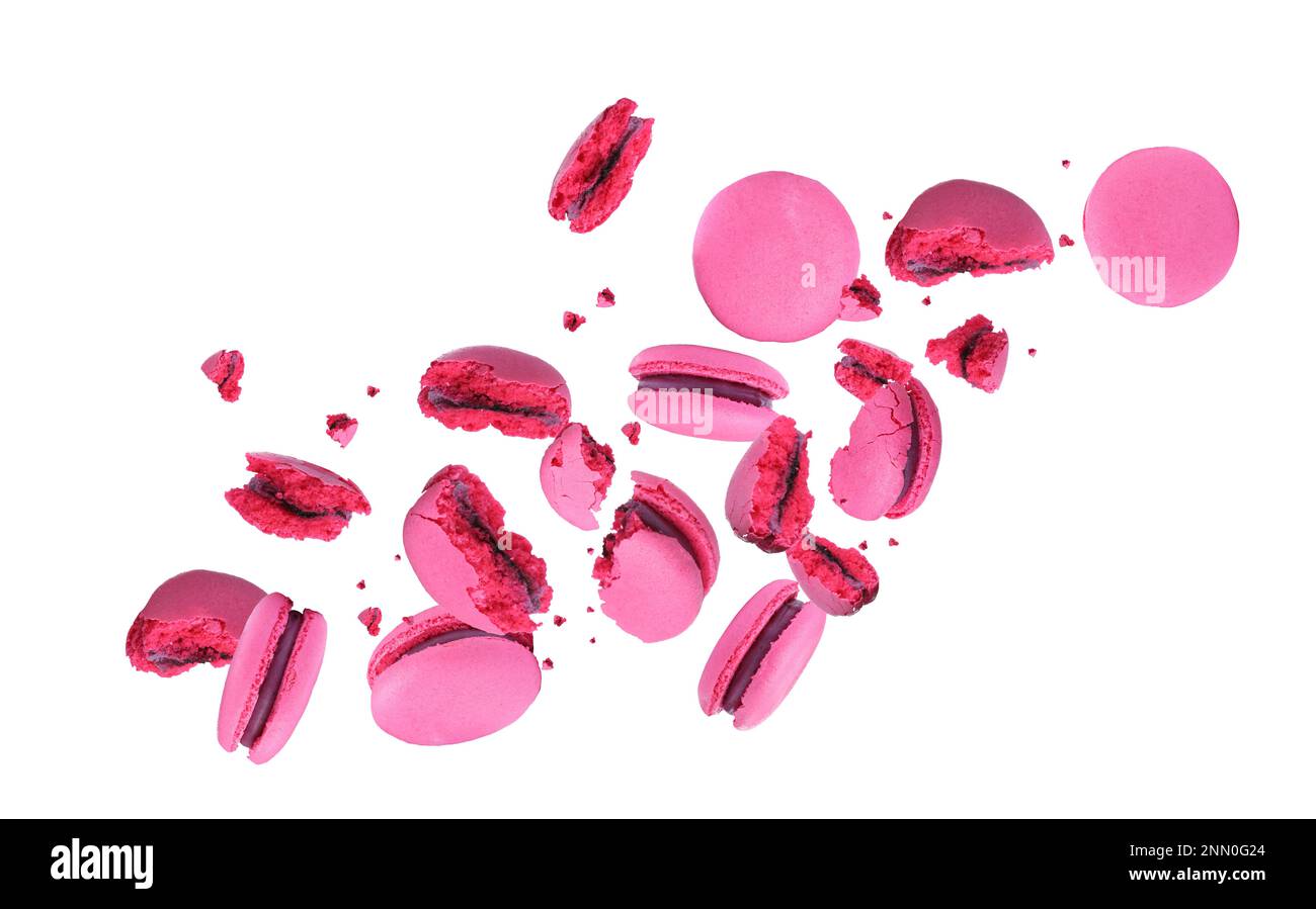 Sweet delicious macarons flying on white background Stock Photo