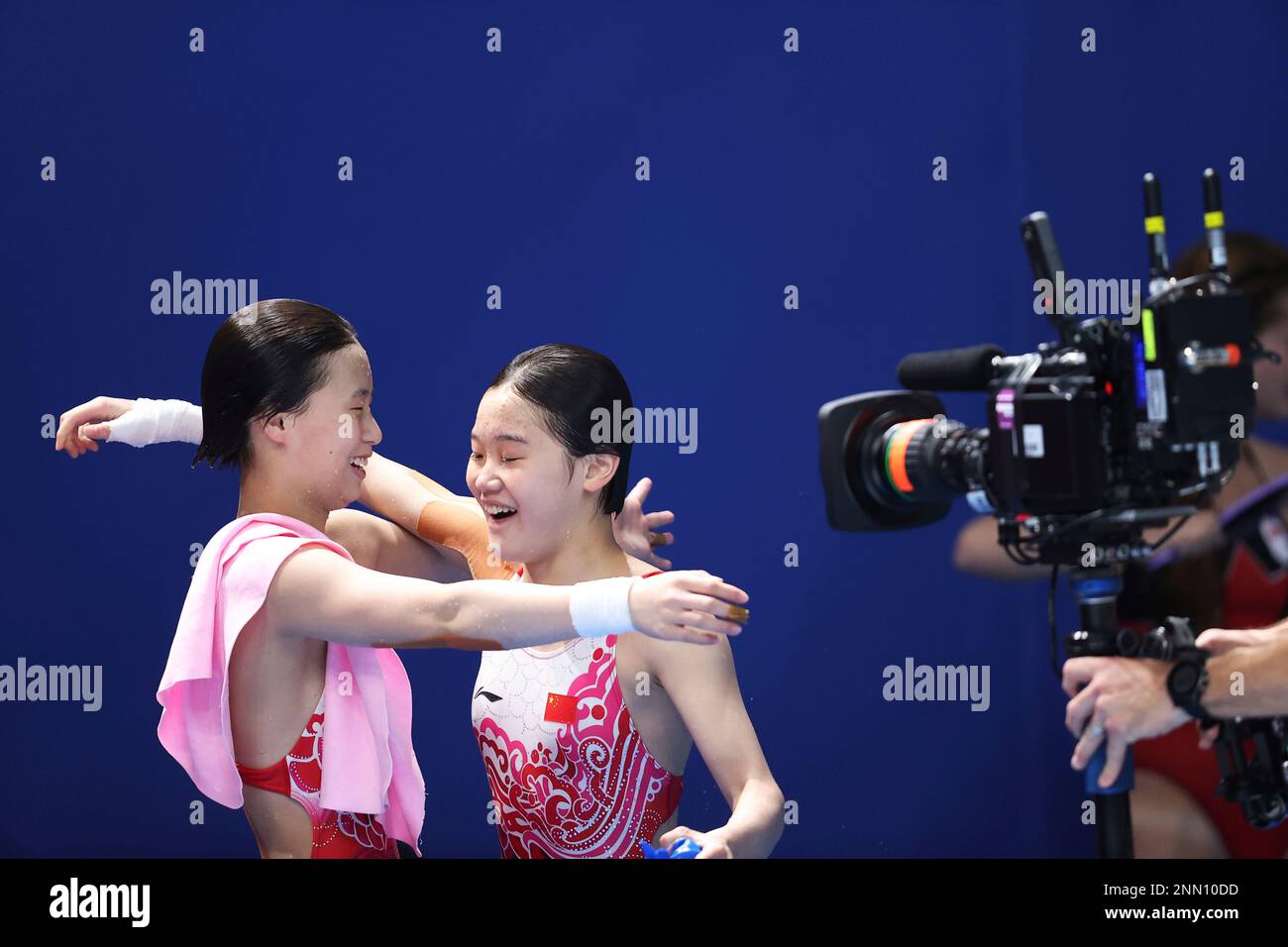 China's CHEN Yuxi and ZHANG Jiaqi perform react after winning Diving ...