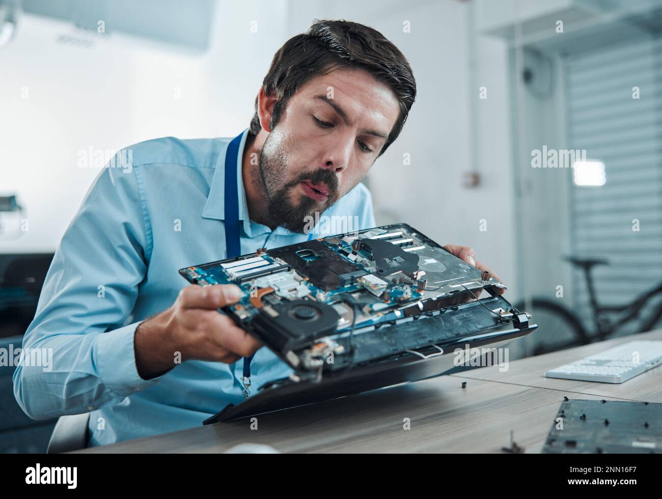 Information technology, laptop circuit repair and man blow hardware