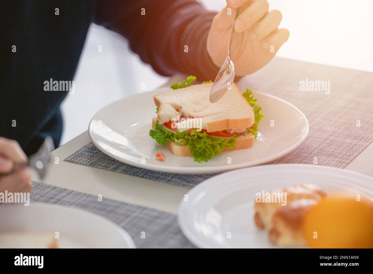 close up vegetable sandwich people eating healthy meal on morning lunch table Stock Photo