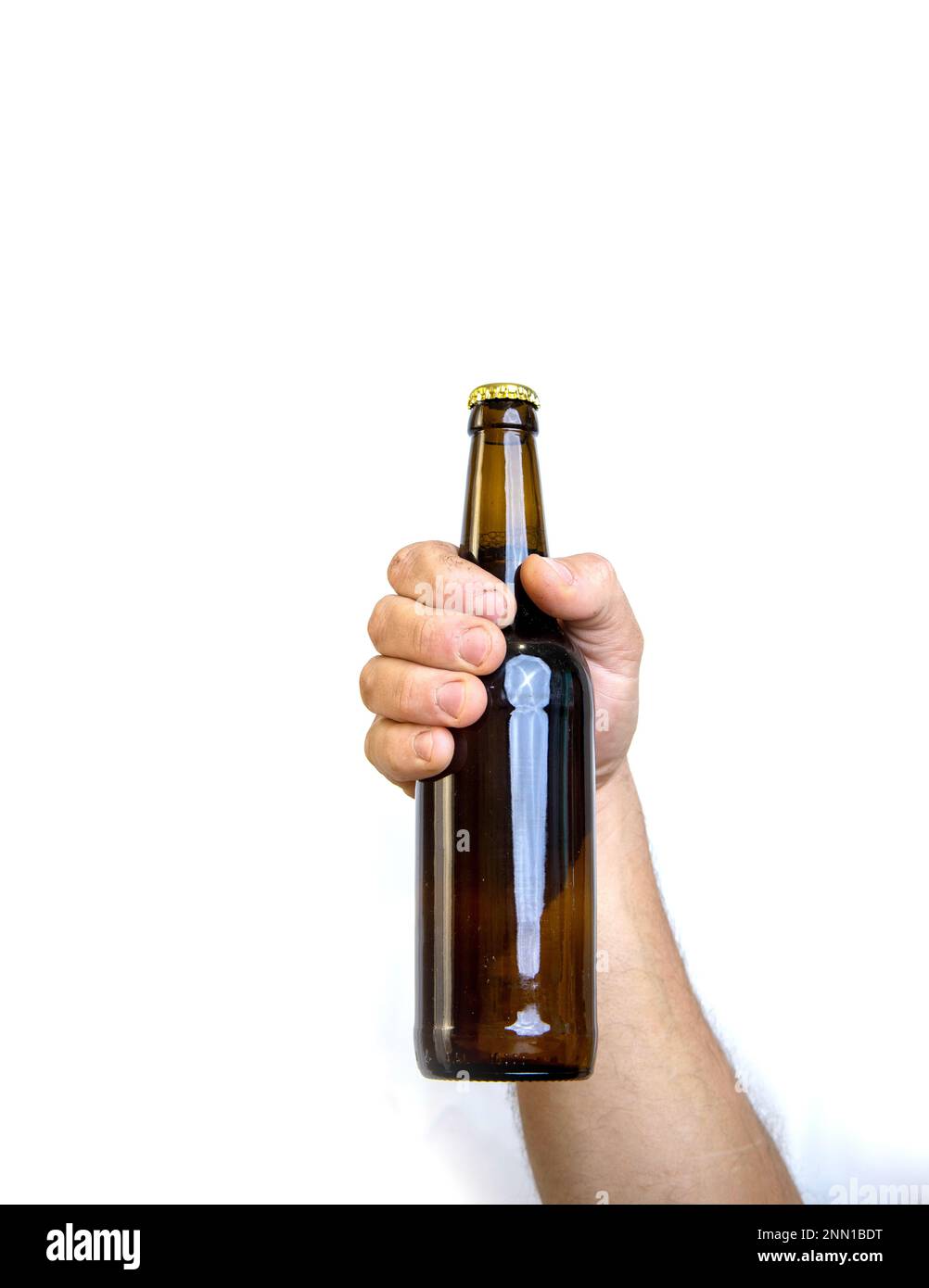 Beer bottle in hand isolated on white Stock Photo - Alamy