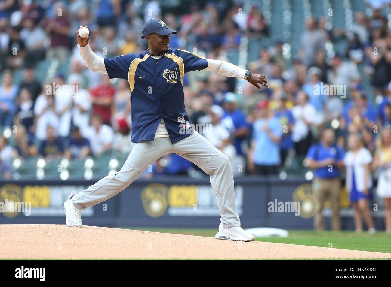 MILWAUKEE, WI - JULY 23: United States Hall of Fame triple jumper Kenny  Harrison throws out the first pitch during a game between the Milwaukee  Brewers and the Chicago White Sox on