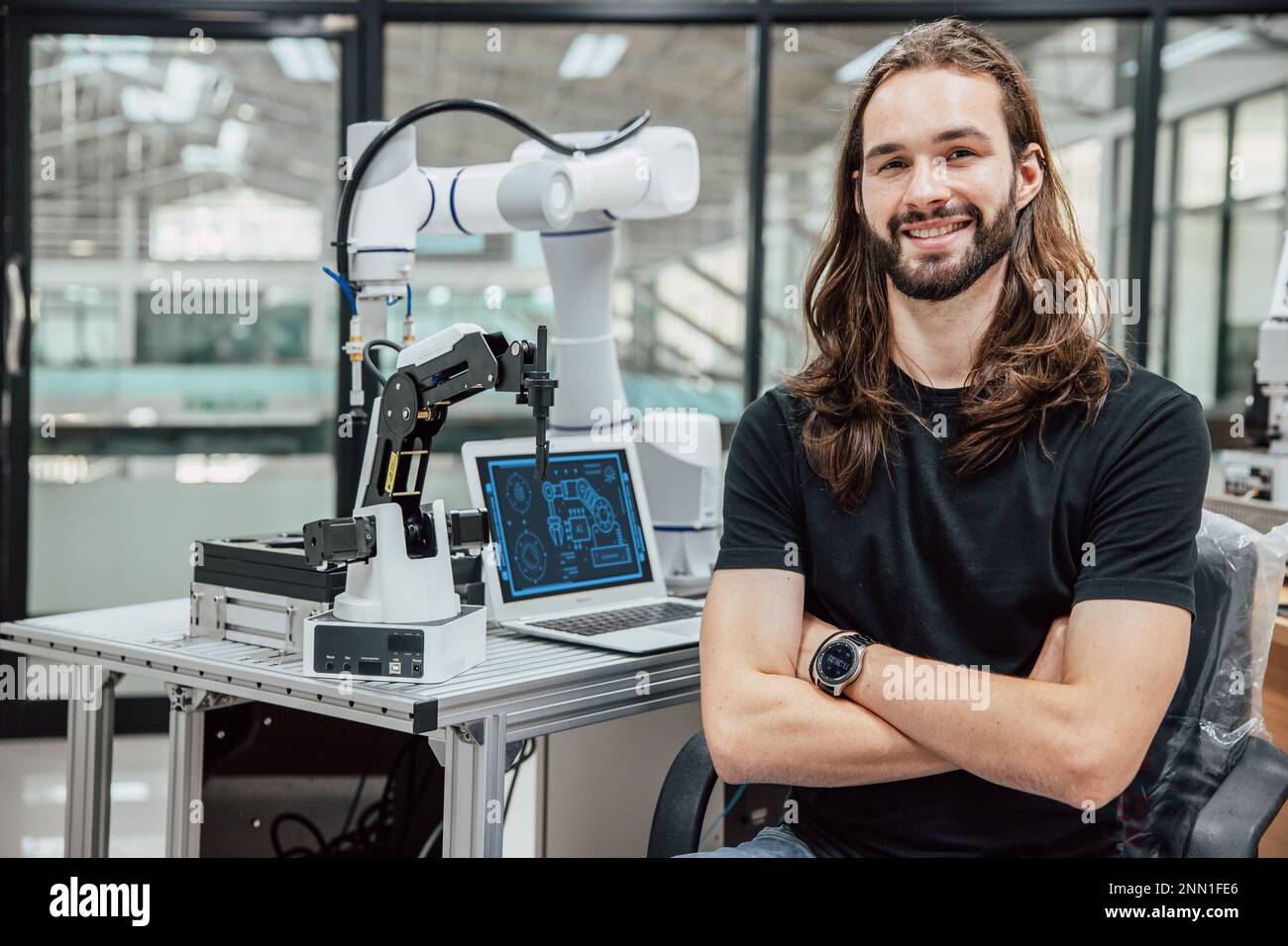 portrait robot engineer programmer. robotic lab research and development team young teen people. Stock Photo