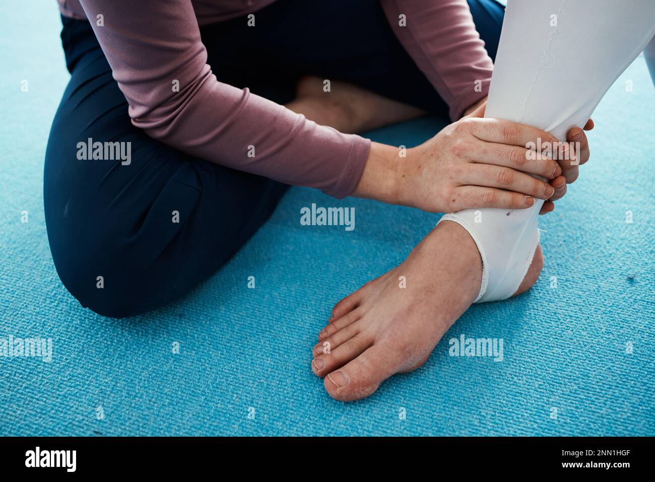 Injury, hurt and foot or ankle pain for athlete getting help from coach