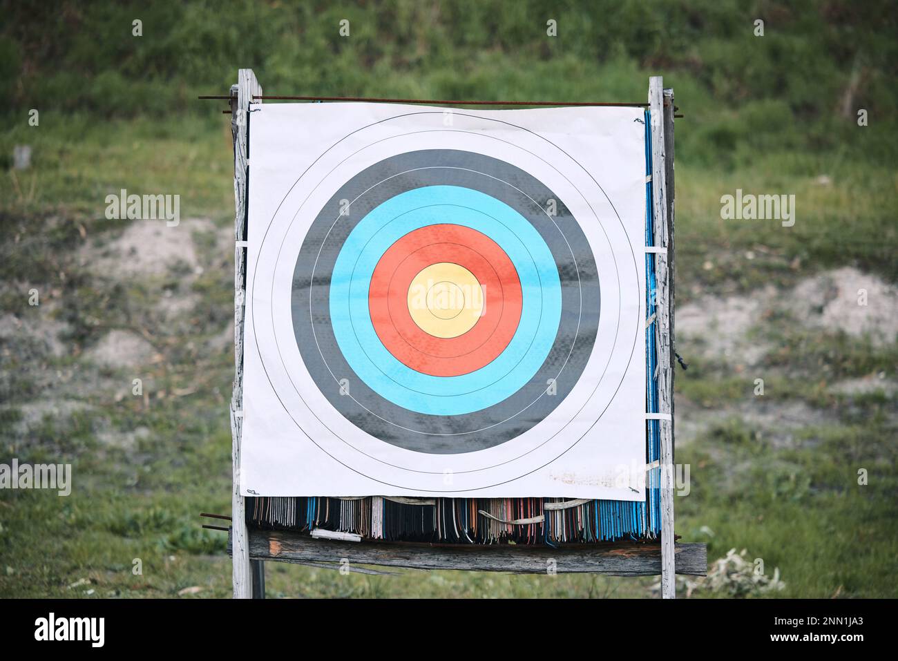 Bullseye target paper, outdoor and board at shooting range for weapon