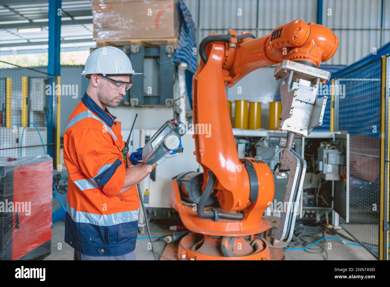 Automation Engineer Service Programming Robotic Arm. New Era Modern Machine Automatic Manufacturing Industry Concept. Stock Photo