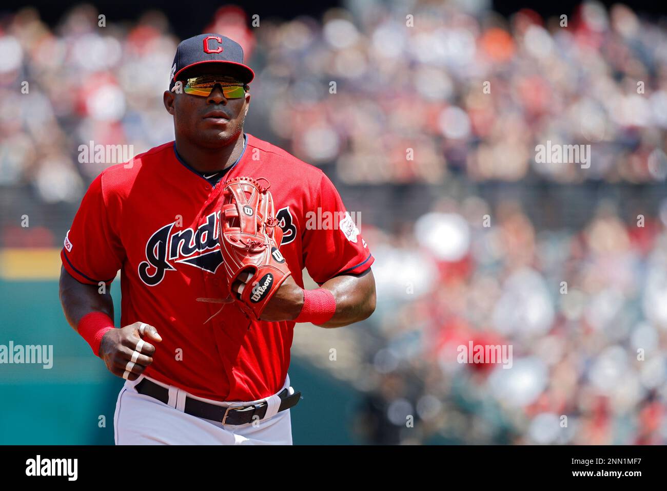 CLEVELAND, OH - AUGUST 04: Yasiel Puig #66 of the Cleveland Indians looks  on during a game against the Los Angeles Angels at Progressive Field on  August 4, 2019 in Cleveland, Ohio.