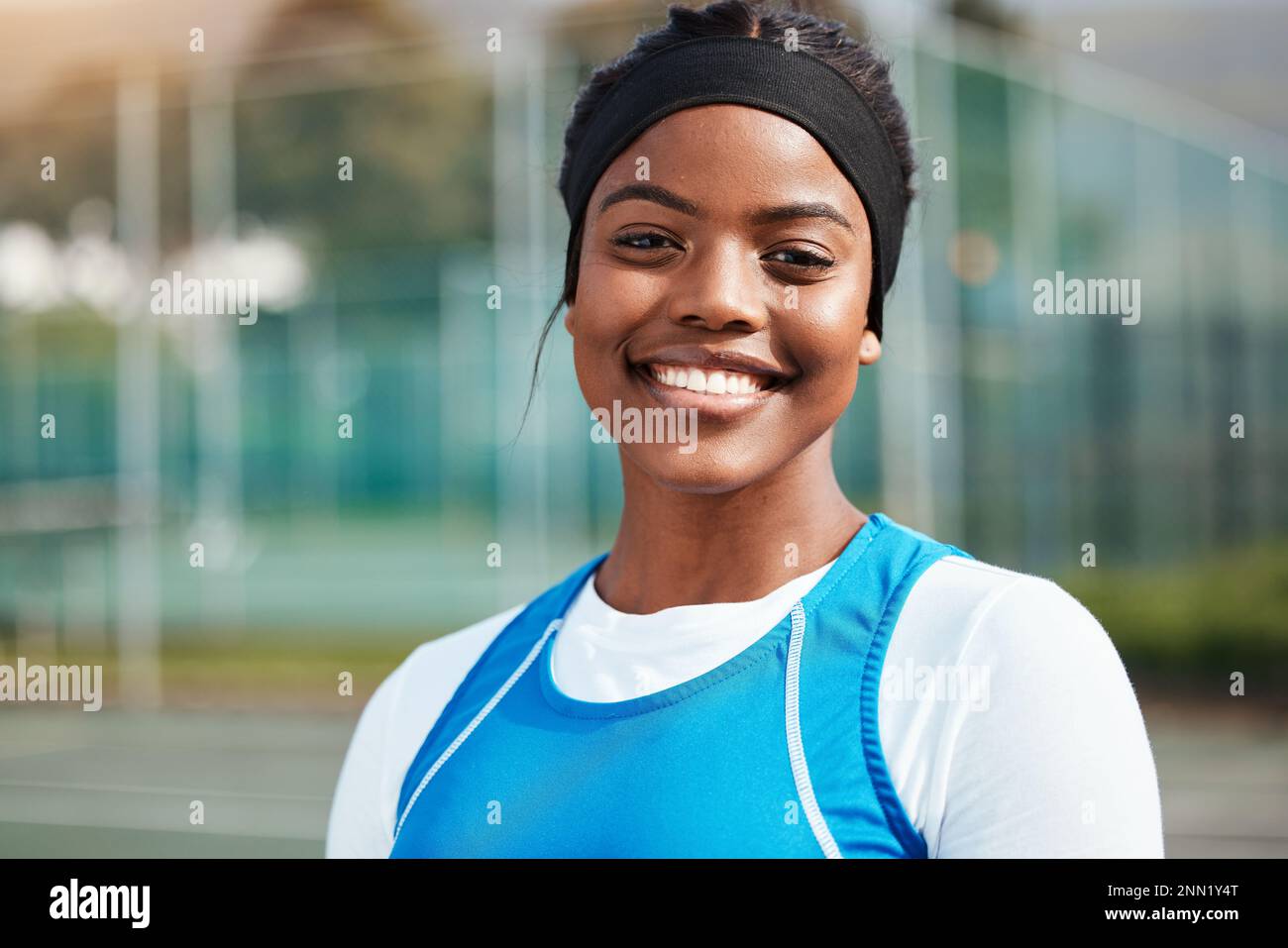 Portrait, black girl with netball and sport with smile, fitness and training for game outdoor, happy teen and ready. Exercise, athlete and African Stock Photo