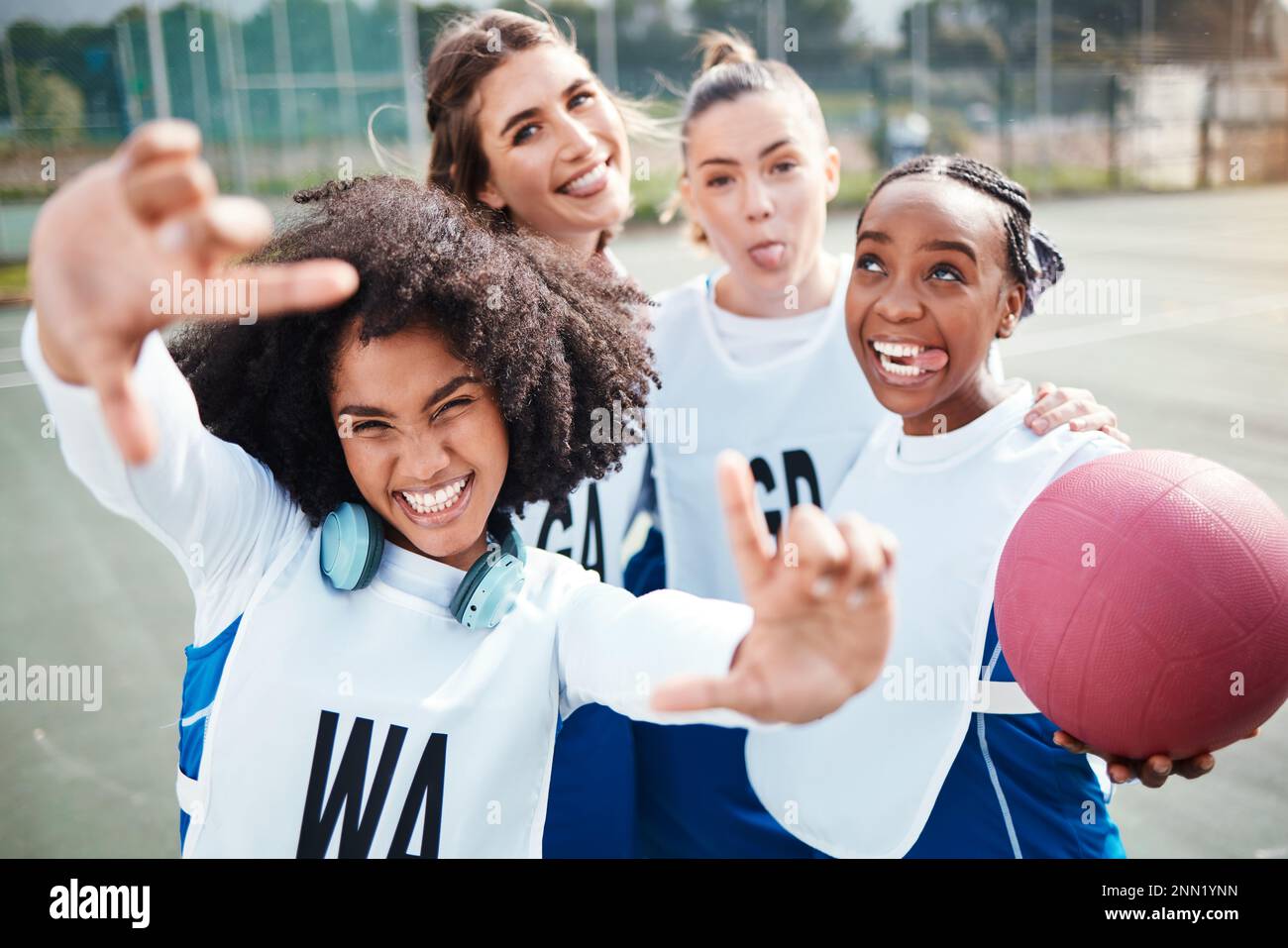 Selfie, frame and a woman netball team having fun on a court outdoor together for fitness or training. Portrait, sports and funny with a group of Stock Photo