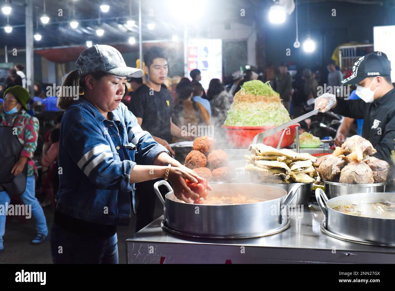 Da Lat, Vietnam 10 February 2023 Vietnamese woman cooking soup in