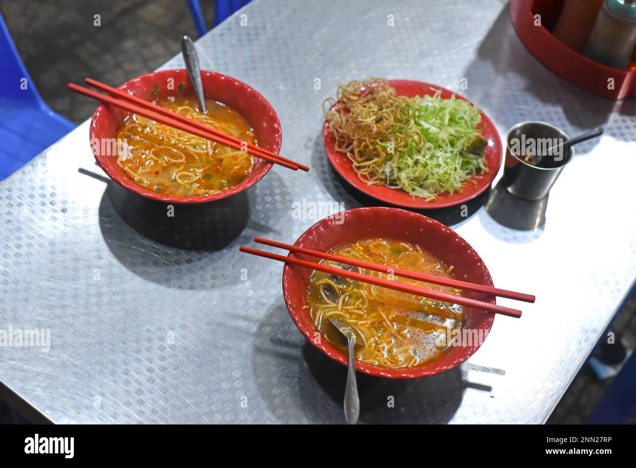 Noodle soup with greens in vietnamese night market in Da Lat Stock