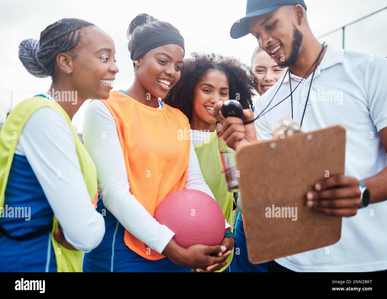 Sports time, netball team and coach check stopwatch after fitness, practice competition or group workout. Health game, watch or diversity women happy Stock Photo