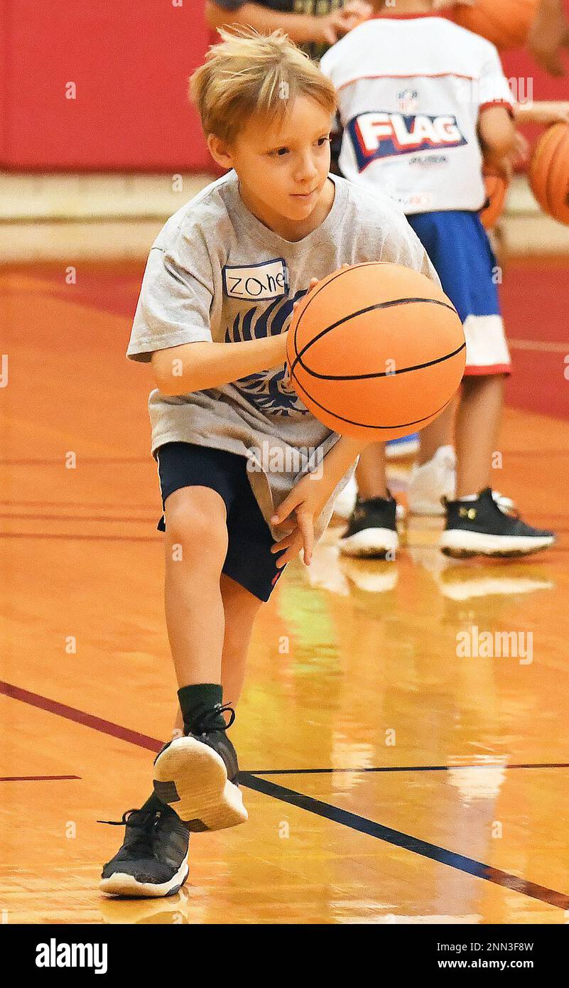 Zane Sanders takes off down the floor for a dribbling drill during the