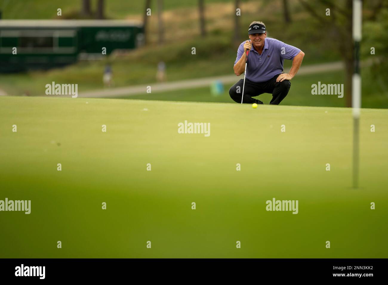 Mike McCoy eyes his shot on the ninth green during the first round of