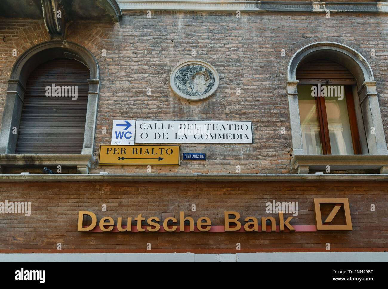 Exterior and sign of the Deutsche Bank in Calle del Teatro o della Commedia in the St Mark's district of Venice, Veneto, Italy Stock Photo
