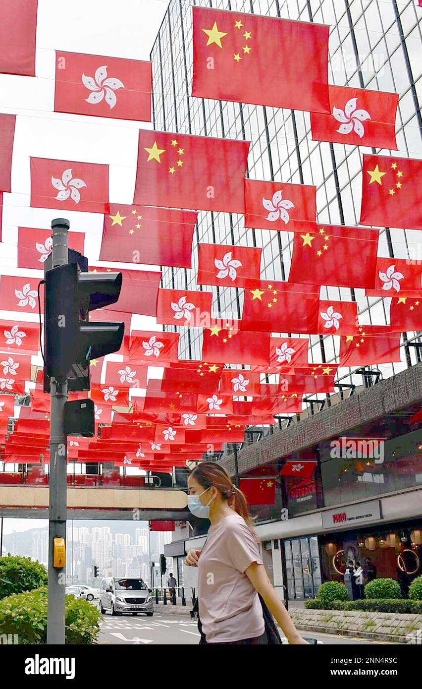 Chinese national flags ann Hong Kong reginal flags are hoisted to