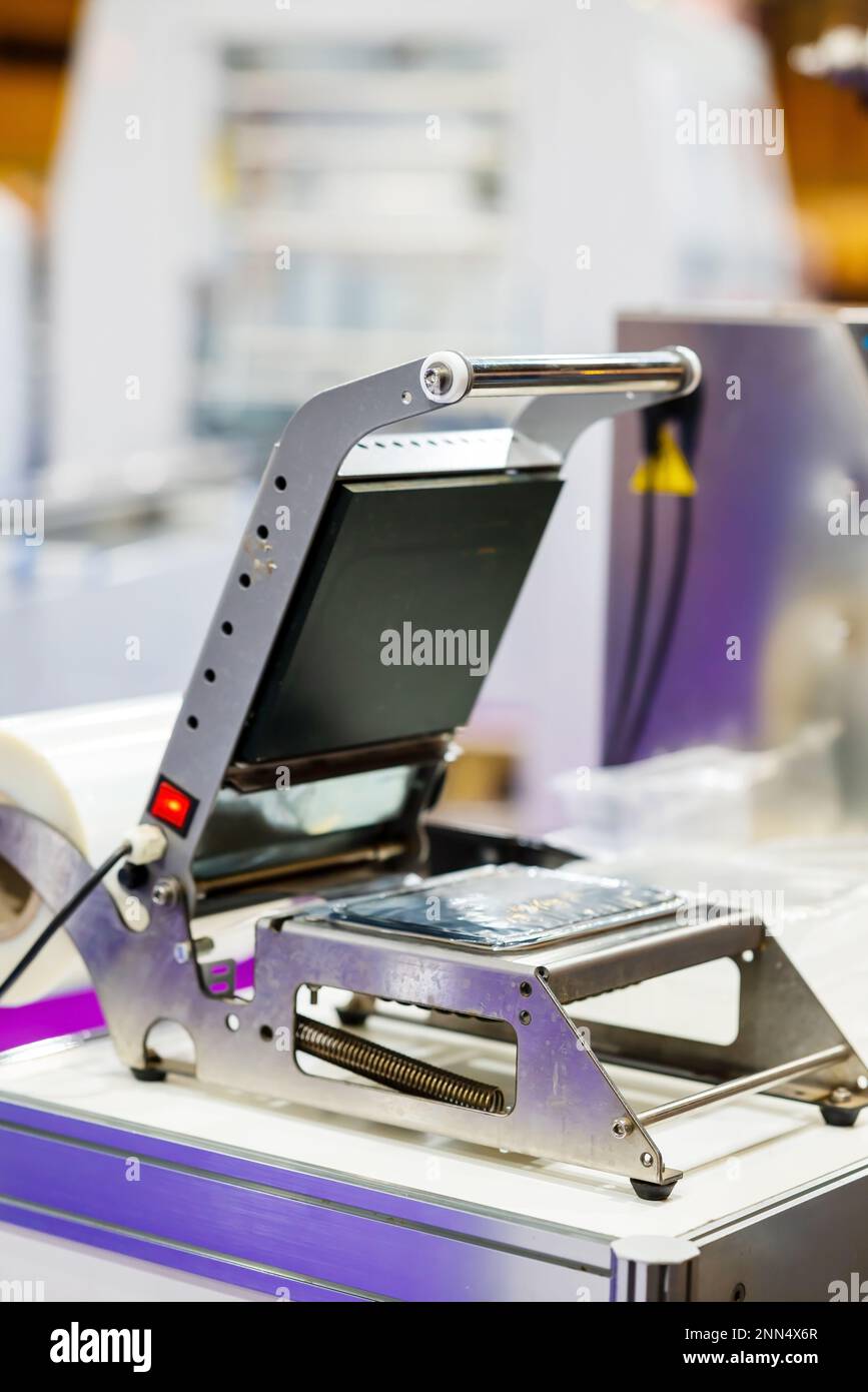 Apparatus for sealing plastic boxes with foil. The concept of