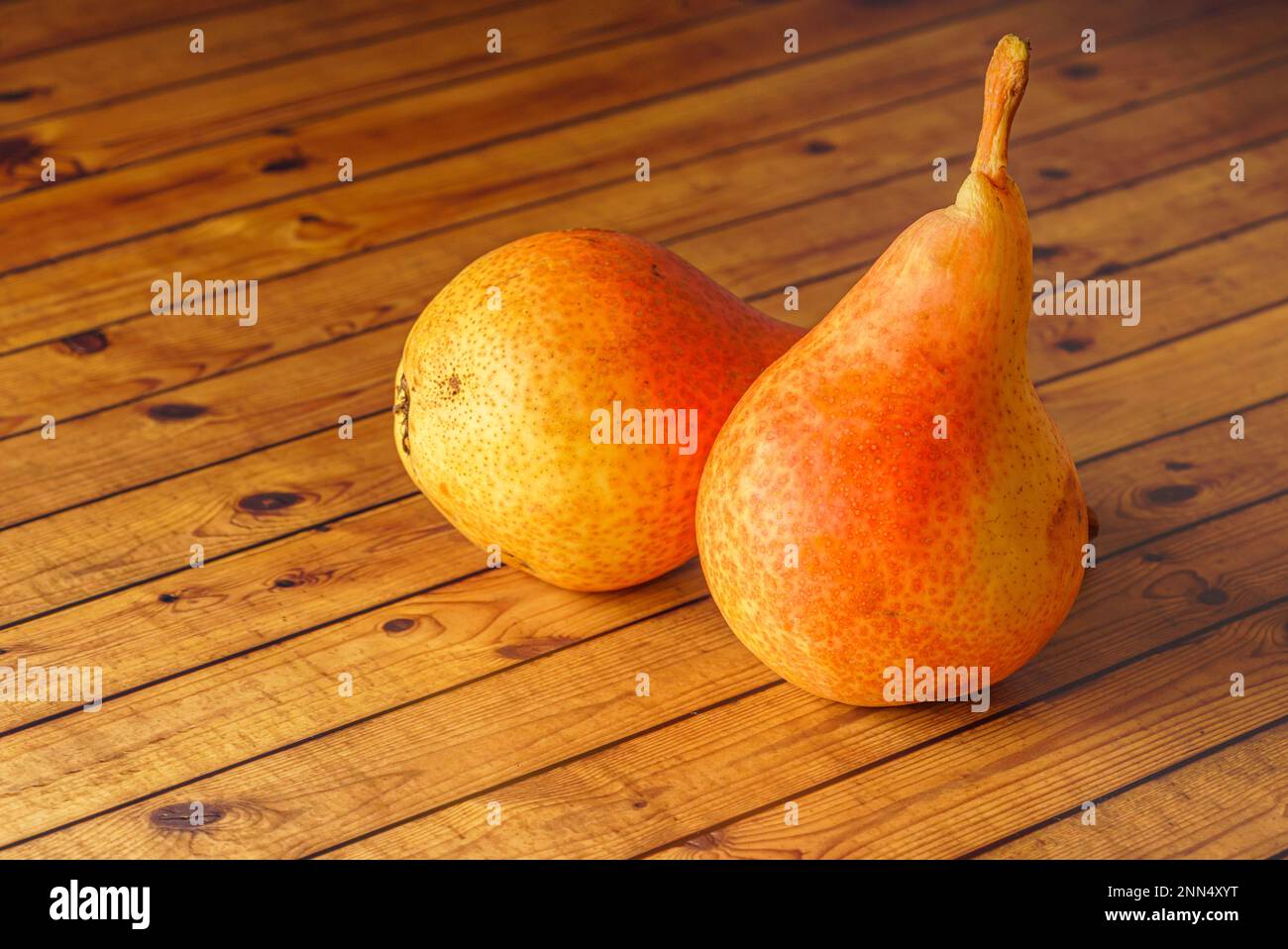 Delicious Williams or Bartlett pears on a rustic wooden kitchen table Stock Photo