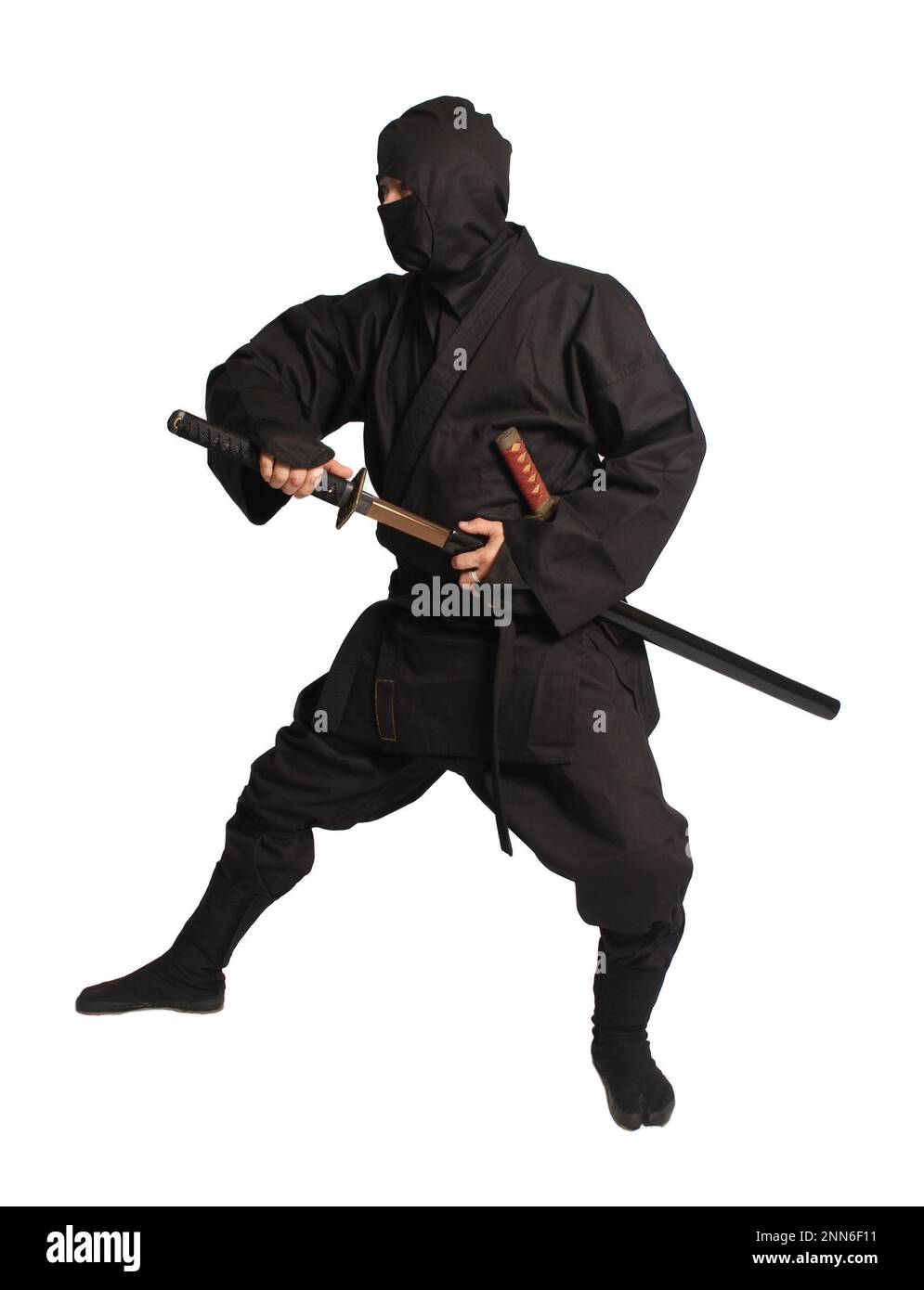 Asian Man Wearing Ninja Martial Arts Uniform Isolated on White