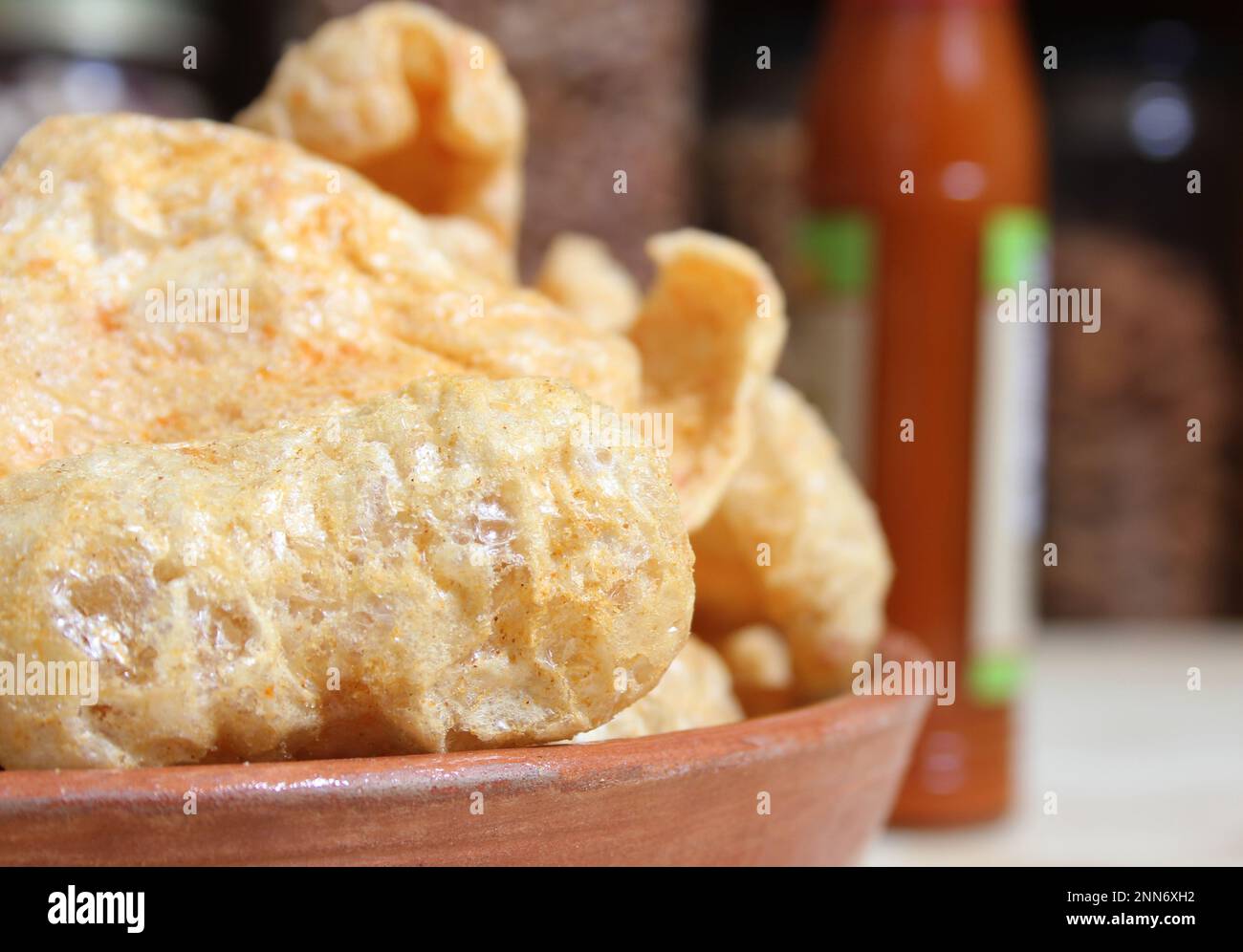 Fried Pork Rinds With Hot Sauce in Rustic Kitchen Stock Photo Alamy