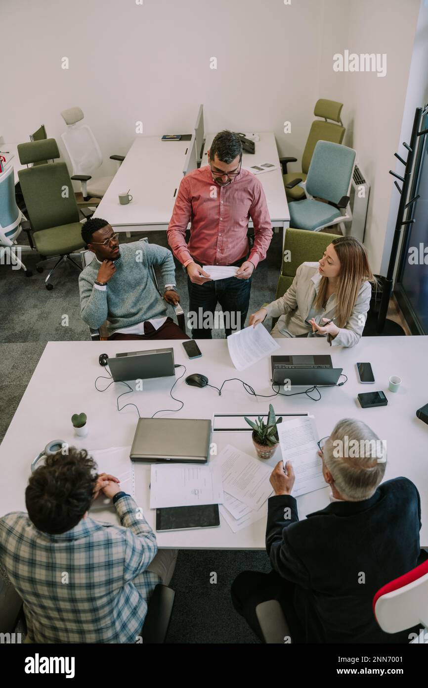 The boss telling his employees about their new job for the client at ...