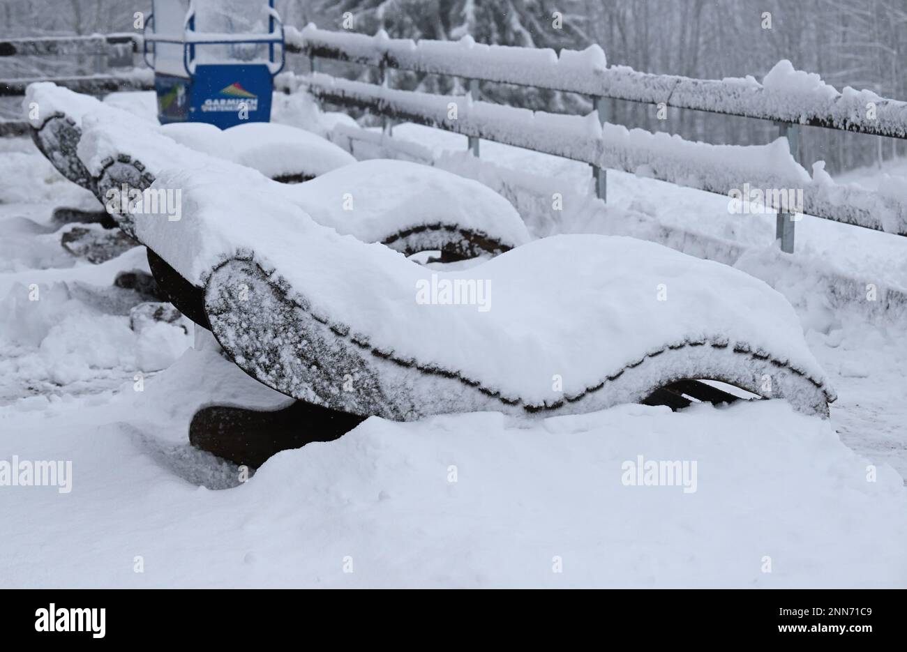 Garmisch Partenkirchen, Germany. 25th Feb, 2023. Sun loungers are freshly snowed in on the Eckbauer. Credit: Angelika Warmuth/dpa/Alamy Live News Stock Photo