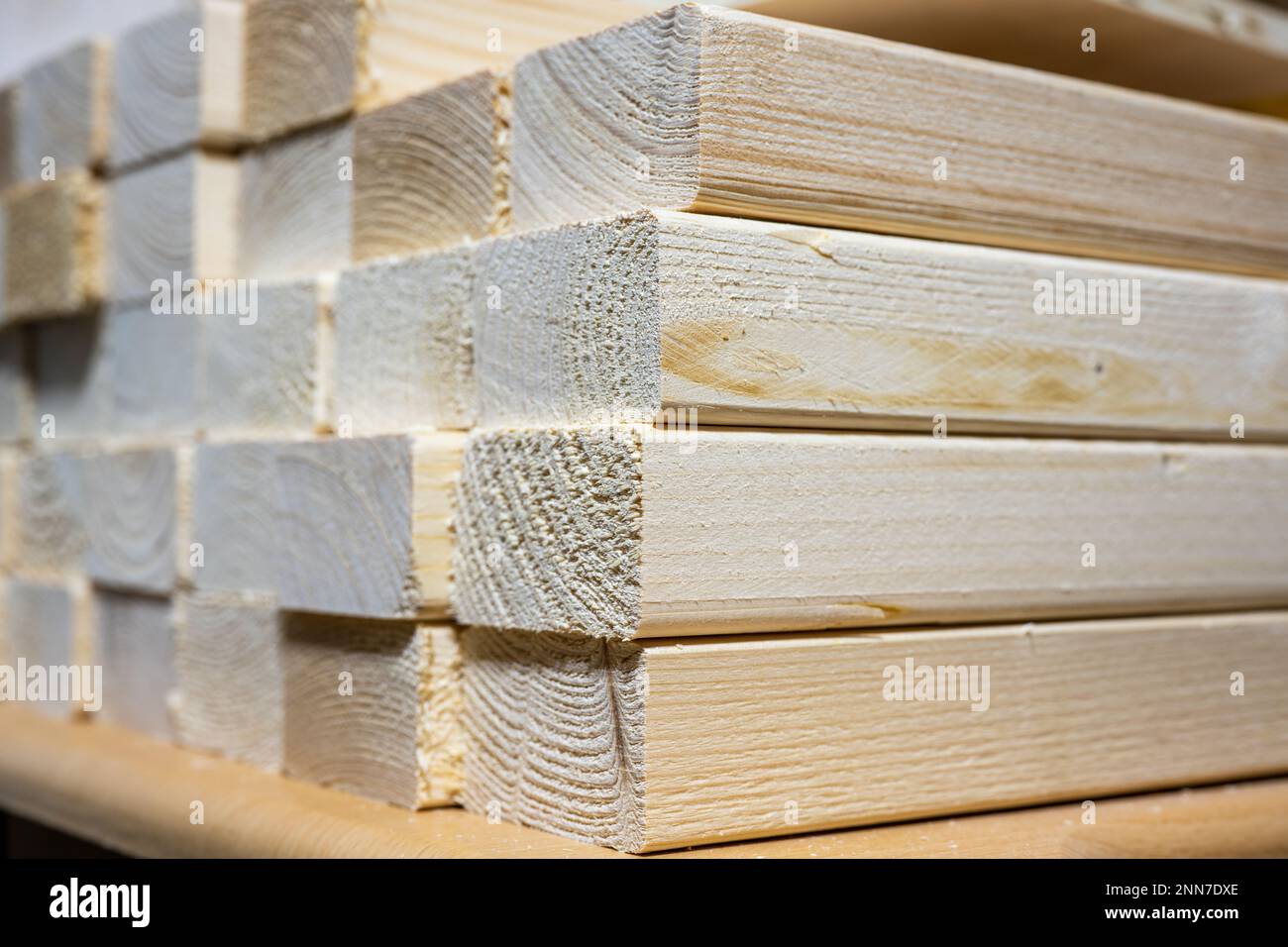 selected focus on the corner of a stacked pile of sawn lumber timber