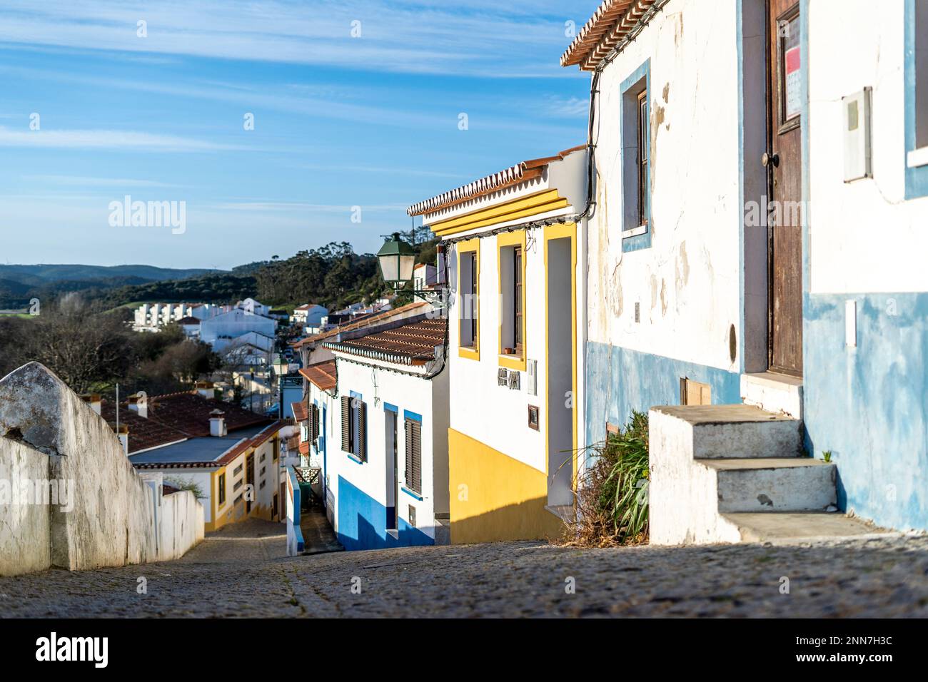 Traditional Portuguese houses with colourful facade. Street with