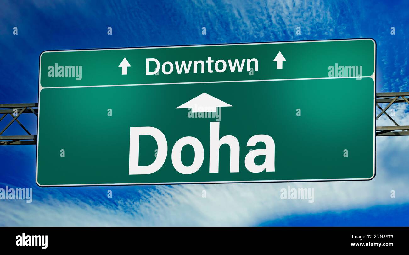 Road sign indicating direction to the city of Doha Stock Photo - Alamy