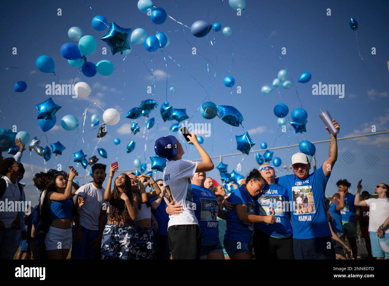 Demaris HobbsEkdahl's mother, Trisha Eckdahl, center, releases