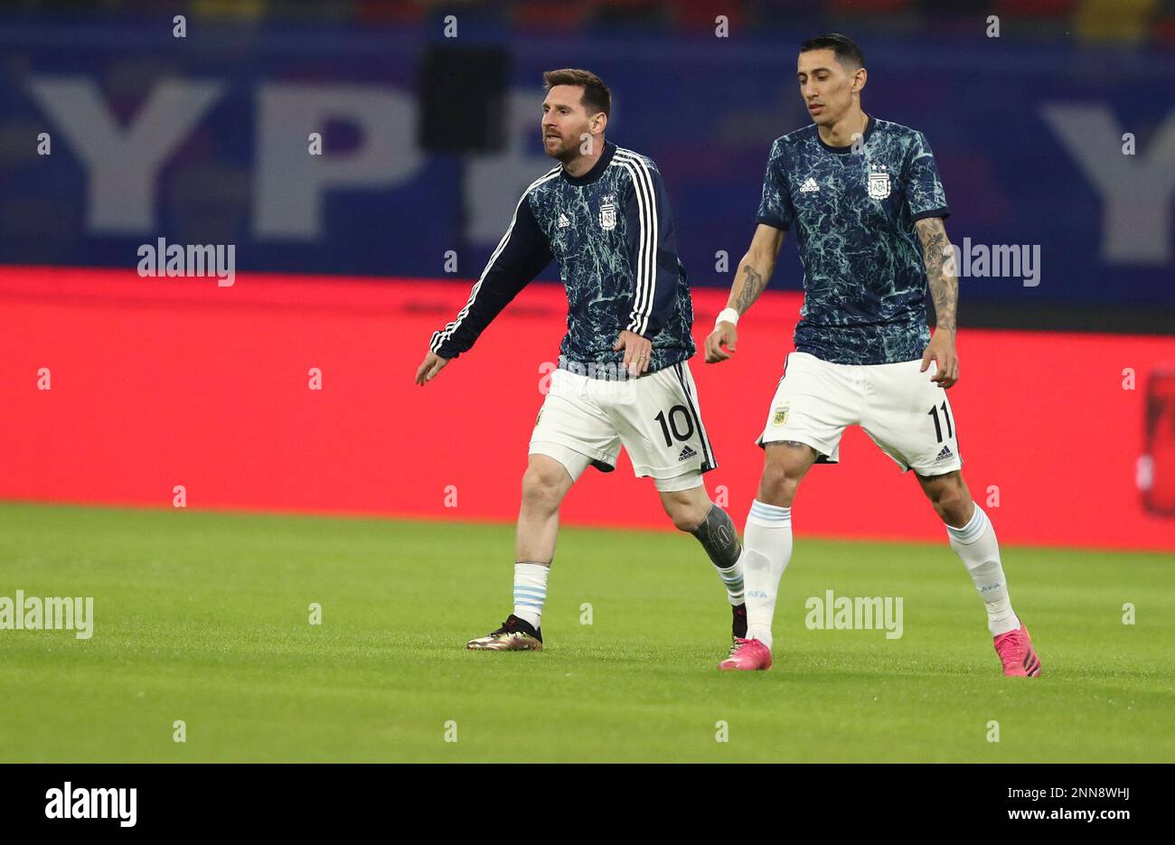 Argentinas Lionel Messi, left, and Angel Di Maria warm up prior to a qualifying soccer match for the FIFA World Cup Qatar 2022 against Chile in Santiago del Estero, Argentina, Thursday, June