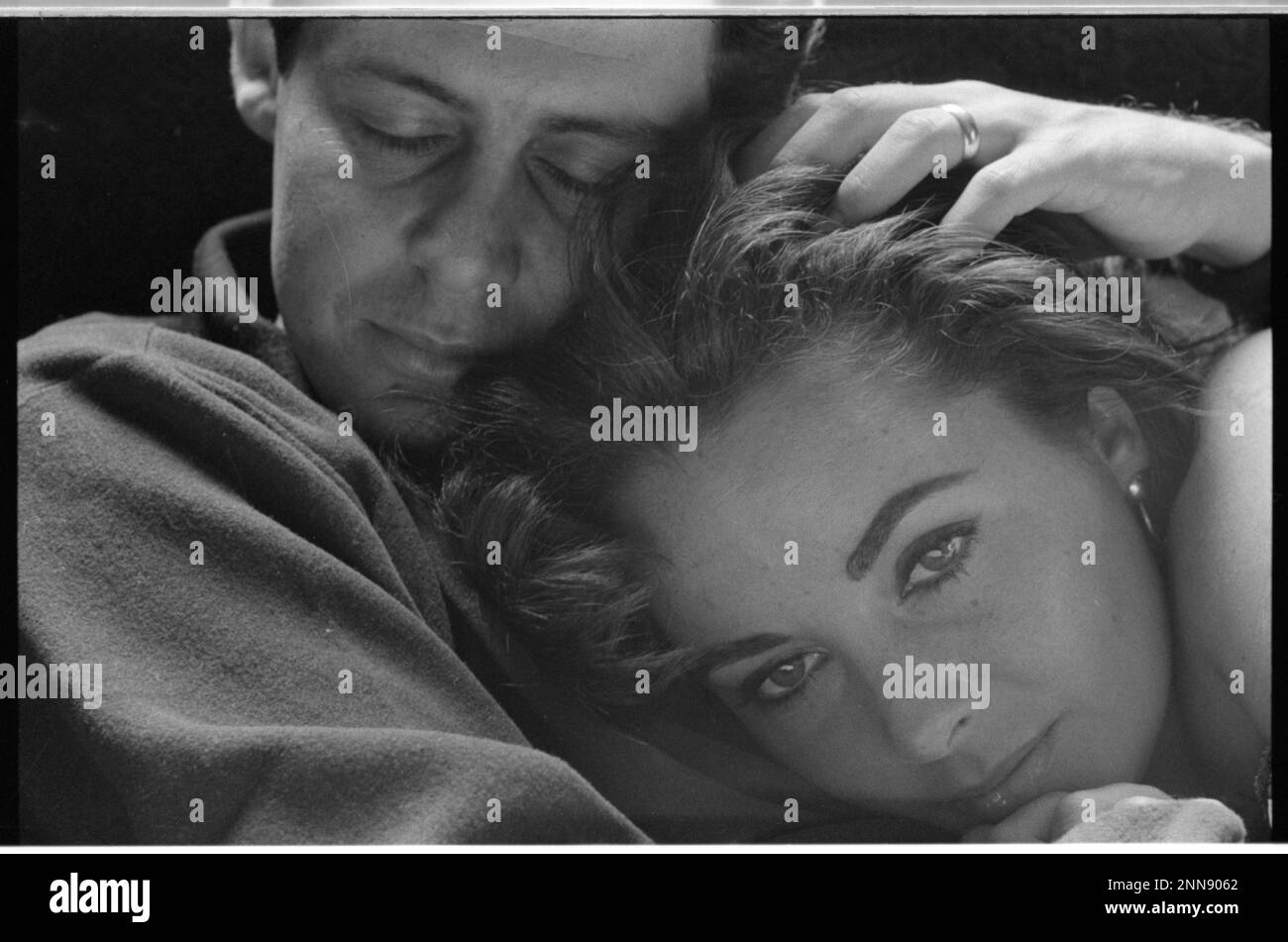 Actress Elizabeth Taylor with her head on then-husband Eddie Fisher, no location, 6/1959. (Photo by Toni Frissell Collection Stock Photo