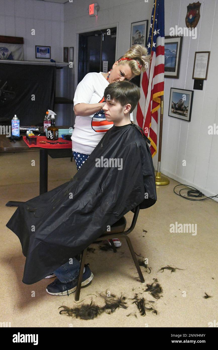 Heather Donati, of Frackville, Pa., gives a haircut to Jordan Russell
