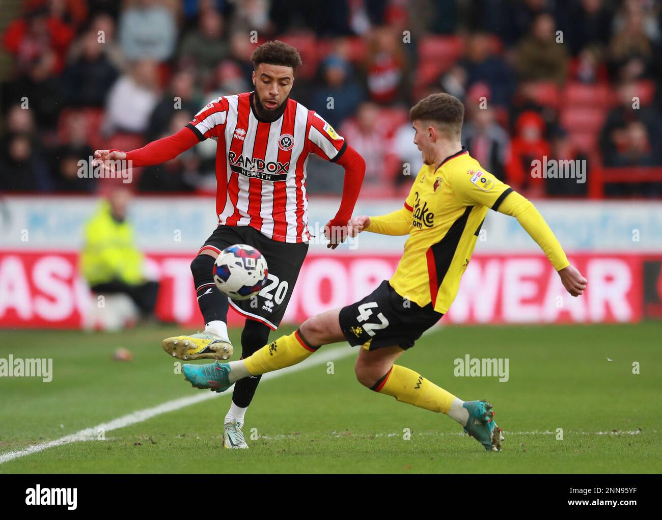 Sheffield, England, 25th February 2023.  Jayden Bogle of Sheffield Ud tussles with James Morris of Watford during the Sky Bet Championship match at Bramall Lane, Sheffield. Picture credit should read: Simon Bellis / Sportimage Credit: Sportimage/Alamy Live News Stock Photo