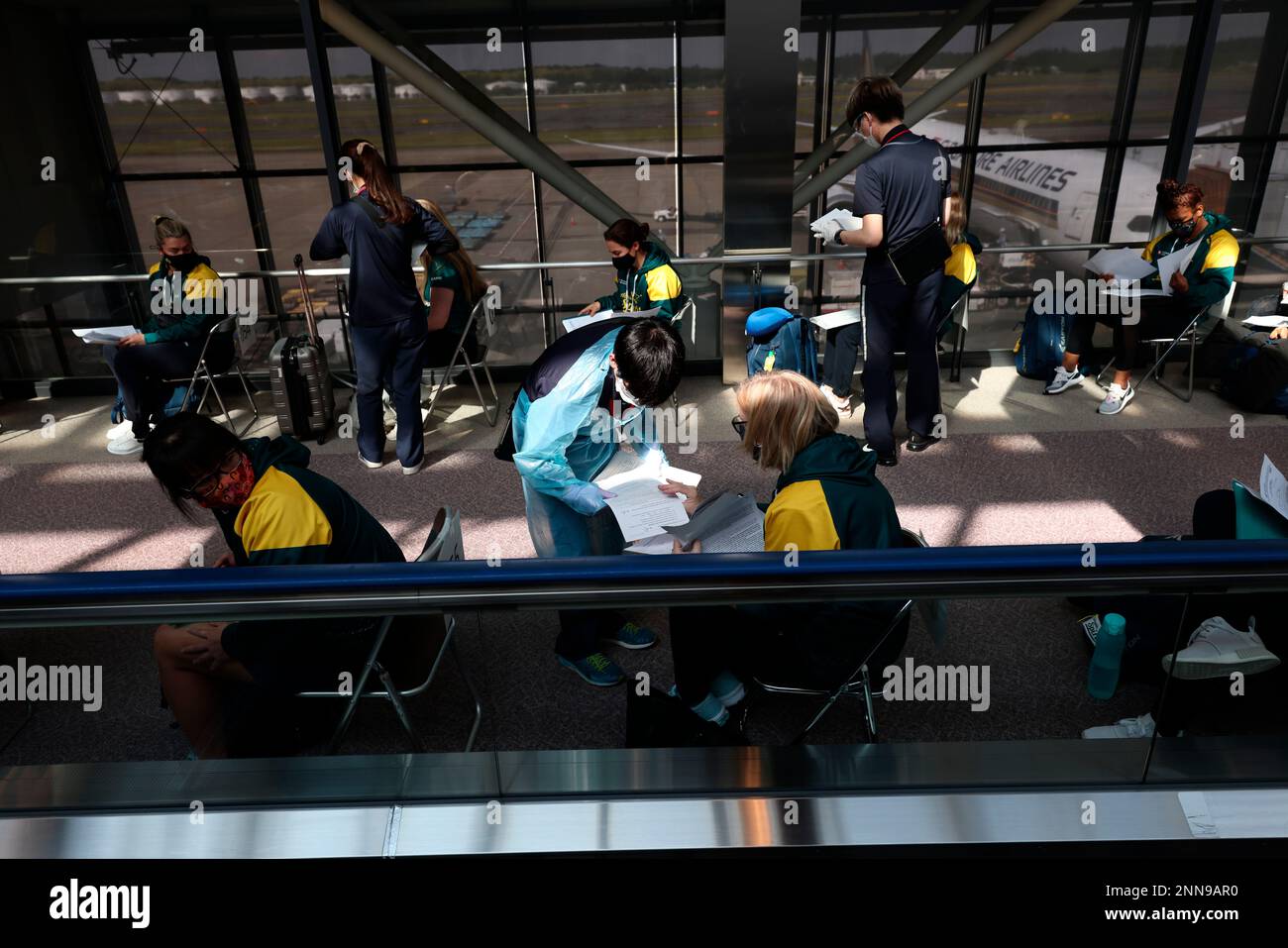 Australian softball national team players wait for antigen test after